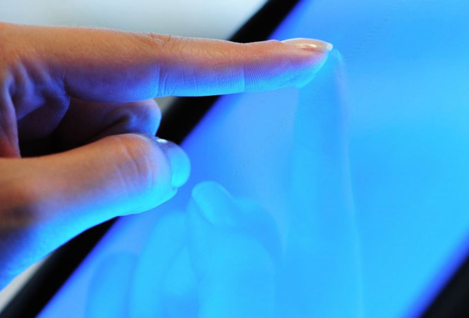 A finger touching on a screen